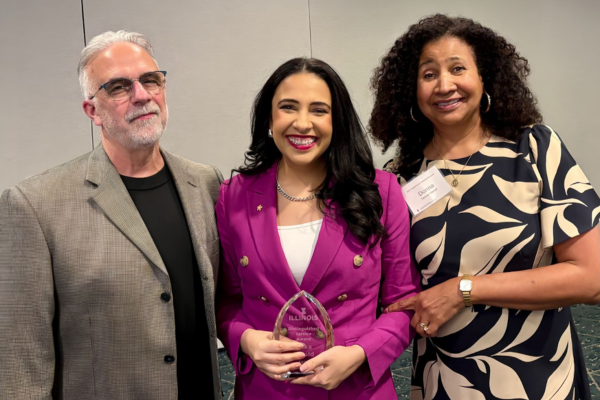 Harold and her parents at the awards ceremony